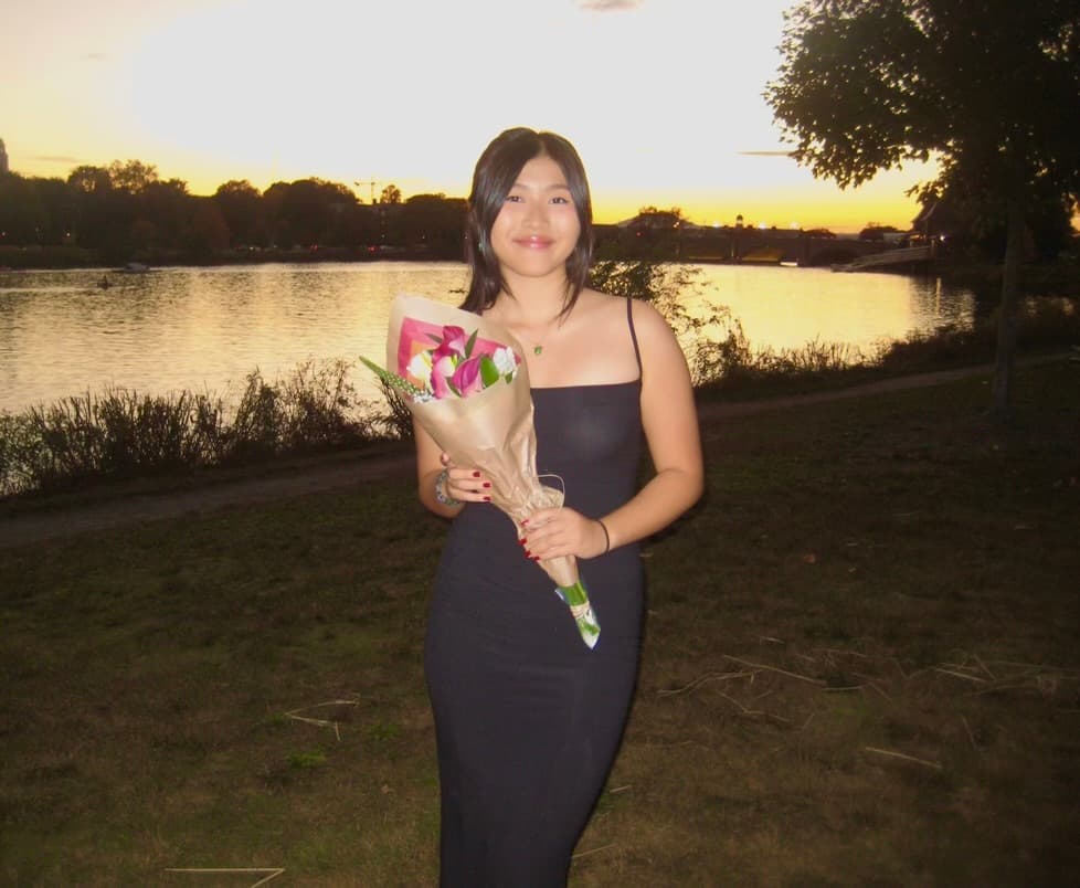 Kacy with flowers at sunset